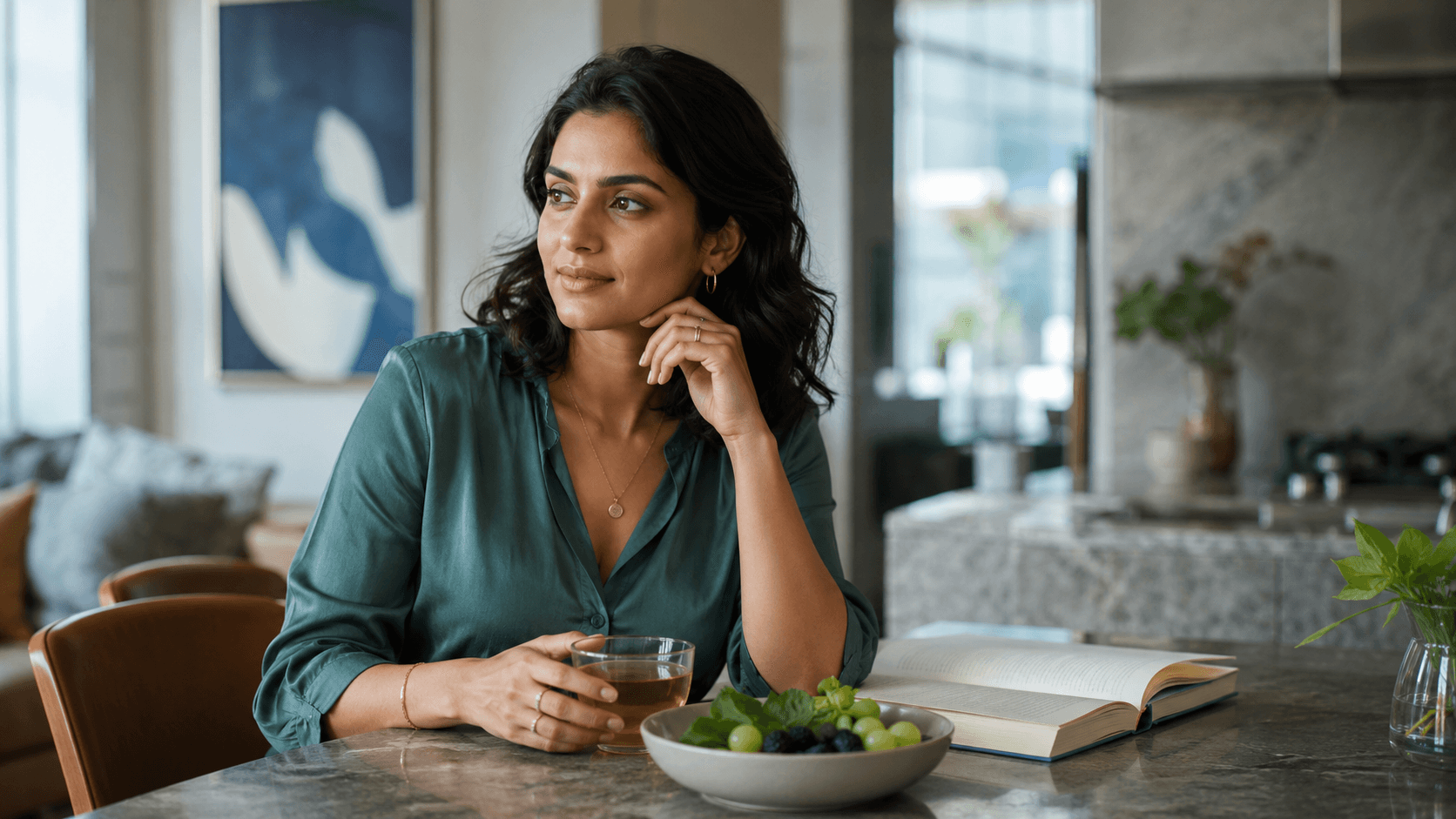 An Indian woman seated in a contemporary home during a calm beauty and wellness ritual